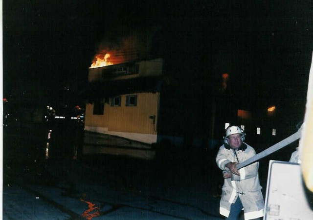 Asst. Chief Mark Beyer pulling hose at the Brass Eagle Restaurant fire... 6/13/92